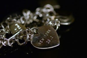 This charm and bracelet represent a personal accomplishment of running the New York City Marathon. Photo by slgckgc (Flickr)