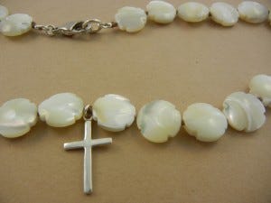 Cross jewelry is a wonderful gift for an occasion that involves someone's Christian faith, such as a baptism. Photo by Irenka Kudlicki (Flickr)