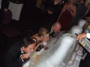 An ice luge is a great way to bring some fun to your wedding guests! Photo via http://ow.ly/VVqxS 