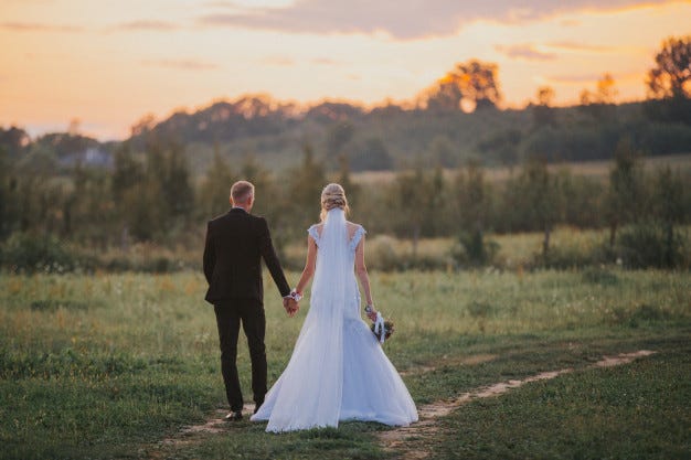 bride and groom holding hands after wedding ceremony